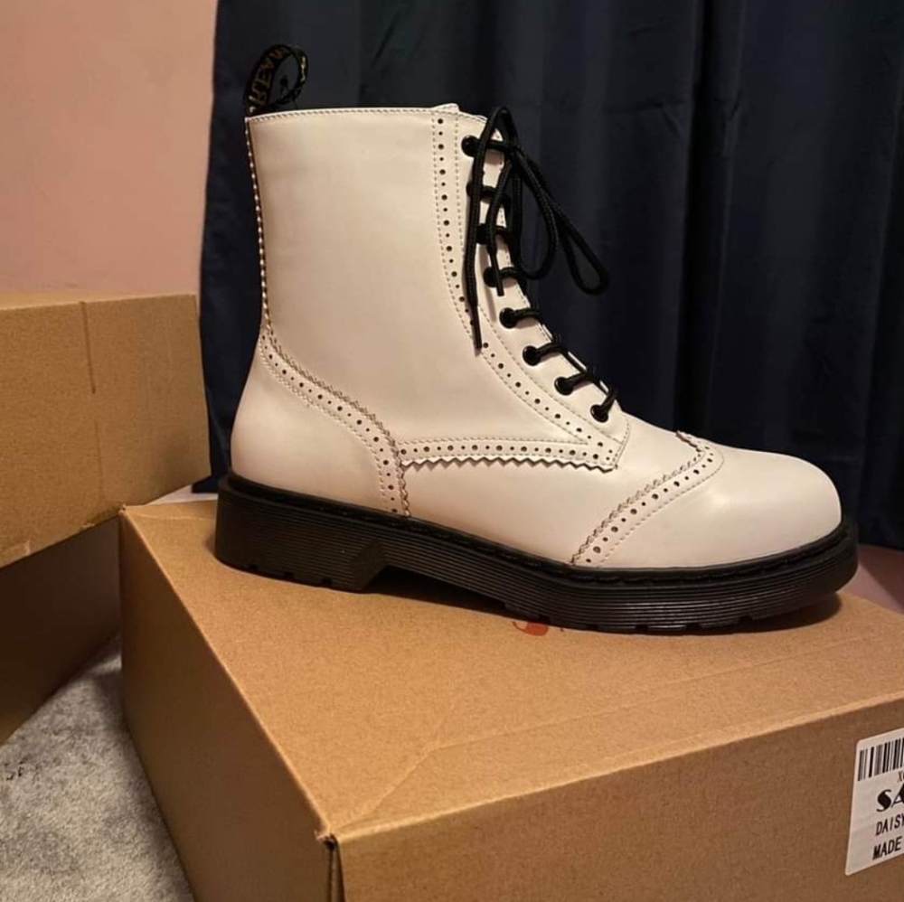 COPY - Classic combat boot with chunky lug sole and branded heel pull tab